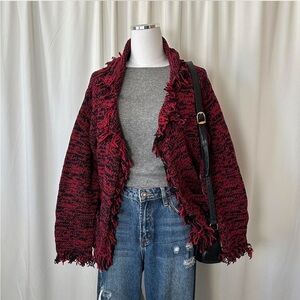 Vintage chunky knit patterned cardigan with fringed edges.